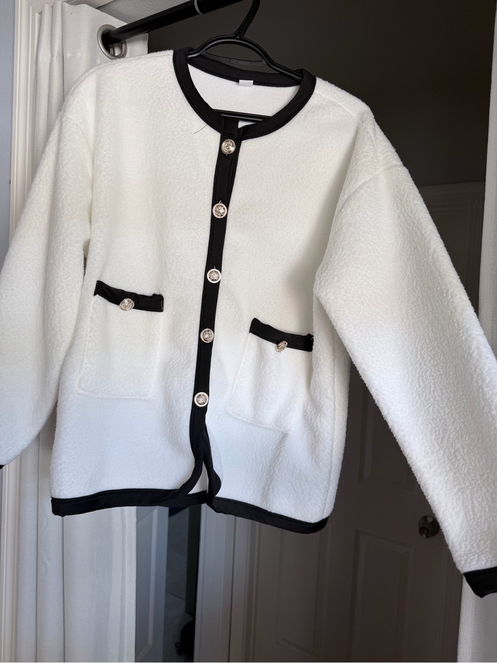 White Bouclé Cardigan with Black Trim and Decorative Buttons